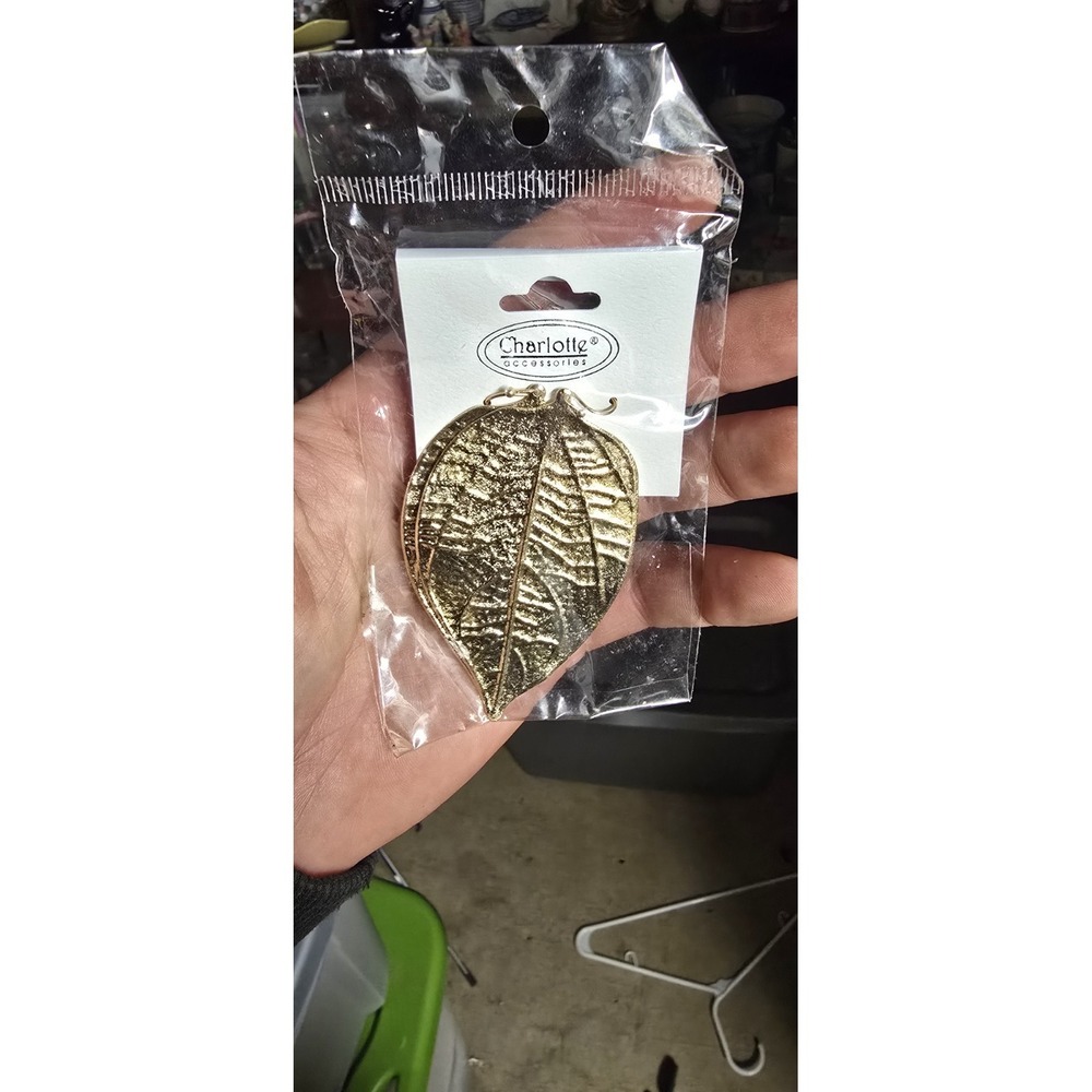 gold-toned metal leaf Earings are produced by the brand Charlotte Accessories.